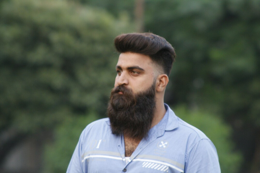 Portrait of a bearded man looking at the camera